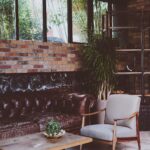 Loft living room with exposed brick, leather sofa and large windows