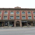 Heritage brick block with storefronts on 9th Avenue SE in Inglewood, Calgary