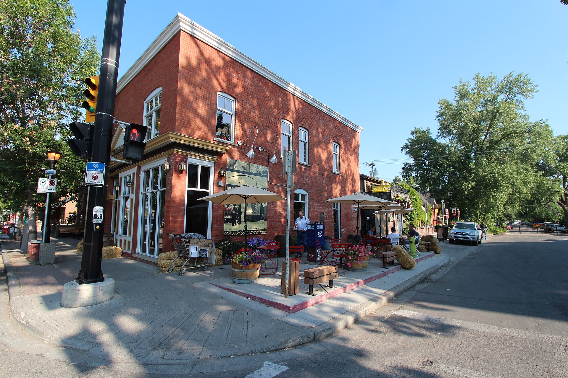 Brick corner cafe with patio in Kensington, Calgary