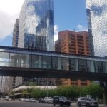 Glass +15 skywalk bridging a downtown Calgary street between office towers