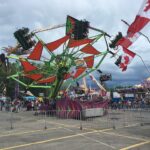 Midway rides and Canadian flags at the Calgary Stampede